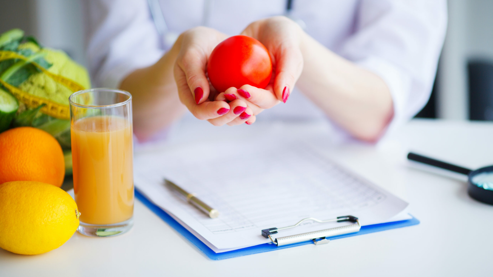 Diet. Doctor Nutritionist hold tomato in her office. Concept of natural food and healthy lifestyle. Fitness and healthy food diet concept. Balanced diet with vegetables.