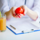 Diet. Doctor Nutritionist hold tomato in her office. Concept of natural food and healthy lifestyle. Fitness and healthy food diet concept. Balanced diet with vegetables.