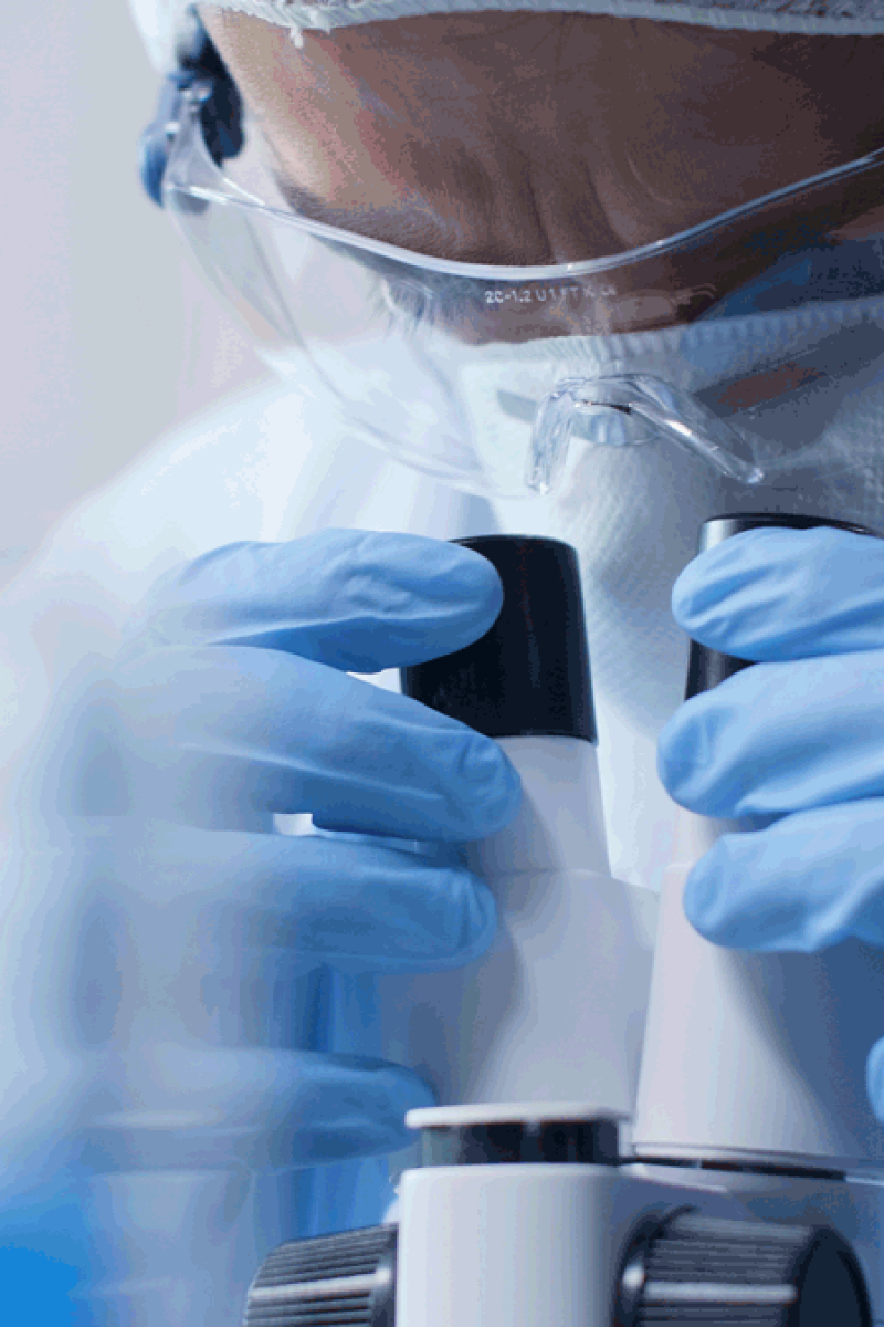 closeup-scientist-doctor-looking-into-medical-microscope-analyzing-blood-sample-during-scientific-experiment-biochemistry-laboratory-researcher-man-developing-vaccine-against-covid19