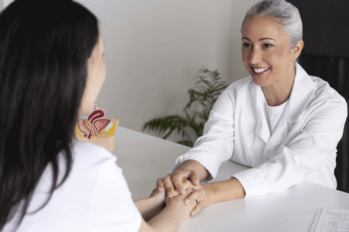 high-angle-smiley-doctor-holding-patient-s-hands