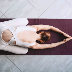 young-woman-practicing-yoga-on-yoga-mat-indoors-2023-05-09-19-54-16-utc